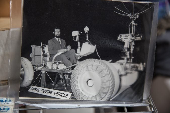 Jacques Tiziou, a french journalist who documented the space program, seen testing out a lunar rover. (Lindsay Lazarski/WHYY)
