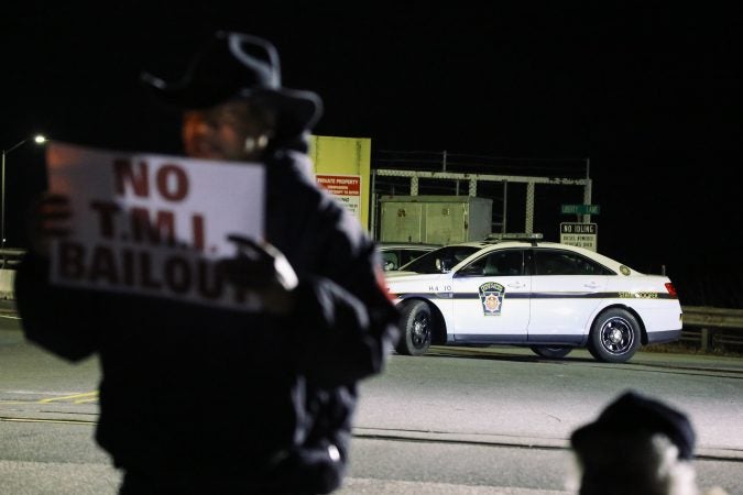 State troopers monitor the event outside the north gate of the Three Mile Island nuclear power plant in Londonderry Township, Dauphin County. (Tim Lambert/WITF)