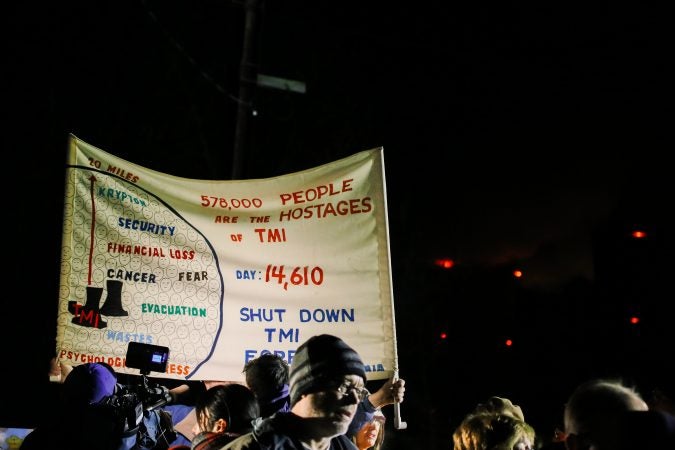 Protesters gather for a vigil outside the north gate of the Three Mile Island nuclear power plant in Londonderry Township, Dauphin County. (Tim Lambert/WITF)