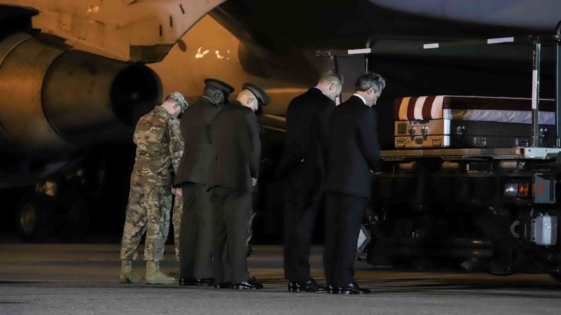 Delaware Governor John Carney prays in front of the transfer case of Staff Sgt. Christopher K.A. Slutman, 43, of Newark, Delaware, during a dignified transfer at Dover Air Force Base Thursday, Apr. 11, 2019,  in Dover, Del. (Saquan Stimpson for WHYY)

Sgt. Slutman died April 8 while conducting combat operations in Parwan province, Afghanistan.