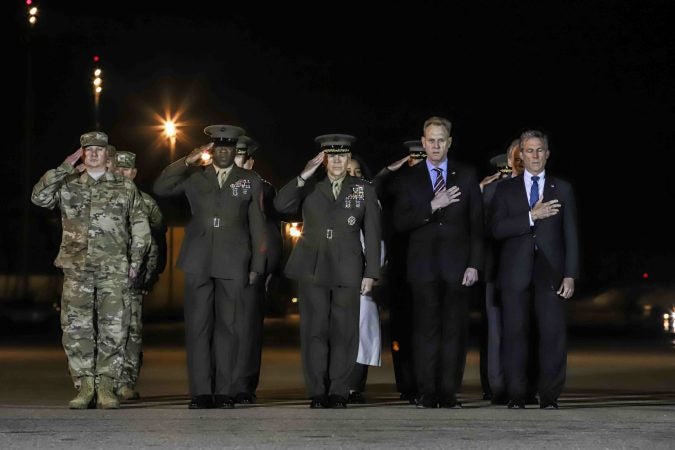 Members of the official party Gov. John Carney, Sgt. Major of the Marine Corps Ronald Green, Commander of the Marine Corps Gen. Robert Neller, acting Secretary of Defense Patrick M. Shanahan and Air Force Col. Matthew Jones, 436th Airlift Wing, Vice Commander attend the dignified transfer of Staff Sgt. Christopher K.A. Slutman at Dover Air Force Base Thursday, Apr. 11, 2019. (Saquan Stimpson for WHYY)