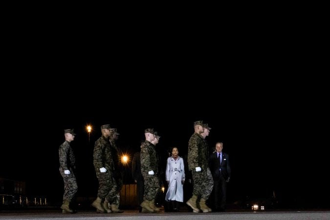 A U.S. Marine Corps carry team walks to the remains of Staff Sgt. Christopher K.A. Slutman during a dignified transfer at Dover Air Force Base Thursday, Apr. 11. (Saquan Stimpson for WHYY)