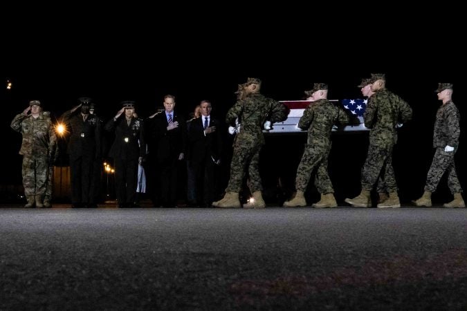 U.S. Marines carry the remains of Staff Sgt. Christopher K.A. Slutman during a dignified transfer at Dover Air Force Base Thursday, Apr. 11, 2019. (Saquan Stimpson for WHYY)