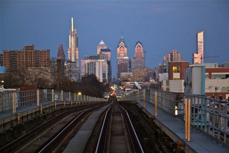 A view of the Philadelphia skyline from the Market-Frankford elevated line in West Philadelphia. (Emma Lee/WHYY)