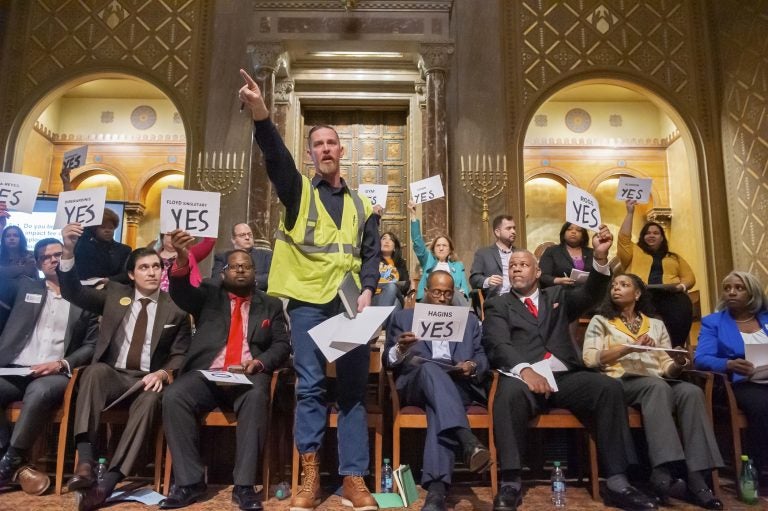 Council at-large candidate Vinny Black stands and responds to a question from a representative speaker. Twenty candidates for city council attended a candidates forum at Congregation Rodeph Shalom on March 24, 2019. (Jonathan Wilson for WHYY)