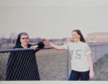 Patricia Cahill (right) greets Sister Eileen Shaw, the nun she says sexually abused her, at an event at Paramus Catholic High School in 1970. (Courtesy of Patricia Cahill)