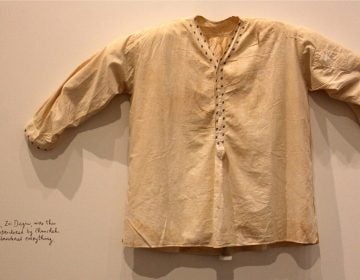 Sara's father's embroidered undershirt is one of many intimate objects and stories passed down through the generations. (Emma Lee/WHYY)