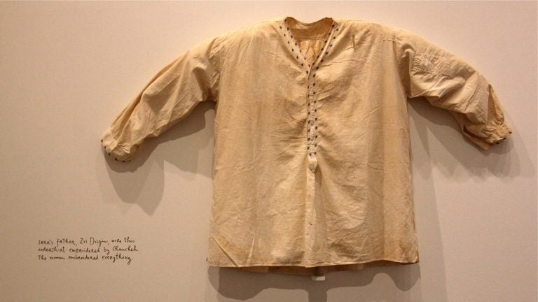 Sara's father's embroidered undershirt is one of many intimate objects and stories passed down through the generations. (Emma Lee/WHYY)