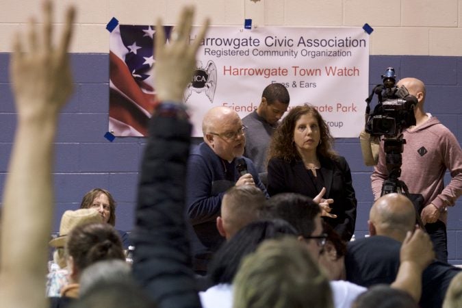 Jose Benitez, Director of Prevention Point and Ronda Goldfein, represent Safehouse during a community meeting at the Heitzman Rec Center on Thursday night. (Bastiaan Slabbers for WHYY)