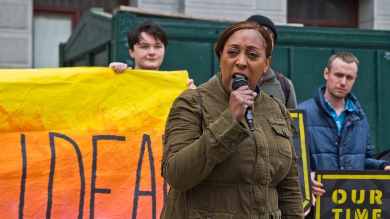 8th District city council candidate Tonya Bah speaks at New Sunrise Movement’s New Green Deal Rally at City Hall Monday. (Kimberly Paynter/WHYY)