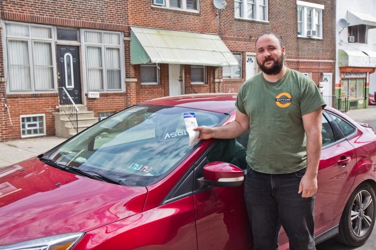 Mark Rascati has been a Philadelphia resident for 3 years. He delivers for Instacart and frequently runs into problems with parking and recently had his car towed. (Kimberly Paynter/WHYY)