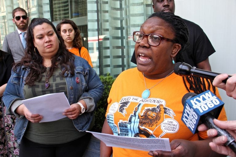 Kendra Brooks (right) with 215  People's Alliance criticizes Philadelphia City Councilman Allan Domb for profiting from the city's 10-year tax abatement program. She is joined by council candidate Erika Almiron (left). (Emma Lee/WHYY)