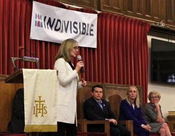 Southeastern Pennsylvania U.S. representatives (from left) Madeleine Dean, Brendan Boyle, Mary Gay Scanlon, and Chrissy Houlahan, address some of the most important concerns of Indivisible Project members during a forum at Tindley Temple United Methodist Church in Philadelphia. (Ximena Conde/WHYY)