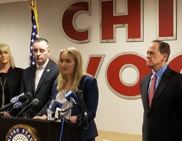 Madison Zezzo, center, speaks about the Combat Online Predators Act flanked by U.S. Rep. Brian Fitzpatrick (left) and U.S. Sens. Pat Toomey and Bob Casey (right). (Tom MacDonald/WHYY)