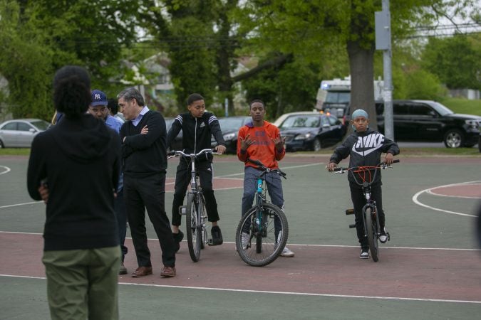 Jayon Hawkins, Amir Brown, and Karon Brown(from left to right) participate in the community rally held in Camden to create safer environment for children on Thursday, April 25, 2019. (Miguel Martinez for WHYY)