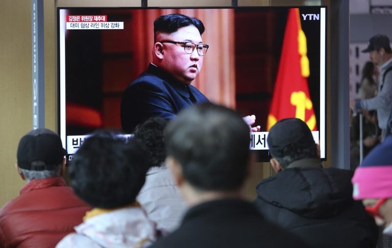 People watch a TV screen showing a file image of North Korean leader Kim Jong Un during a news program at the Seoul Railway Station in Seoul, South Korea, Friday, April 12, 2019. Kim was elected chairman of the State Affairs Commission, and a new premier was chosen by the government's parliament, the Korean Central News Agency reports. (Ahn Young-joon/AP Photo)
