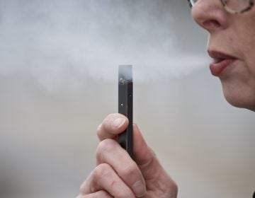 Chantel Williams exhales a puff of vapor from a Juul pen in Vancouver, Wash., Tuesday, April 16, 2019. (Craig Mitchelldyer/AP Photo)