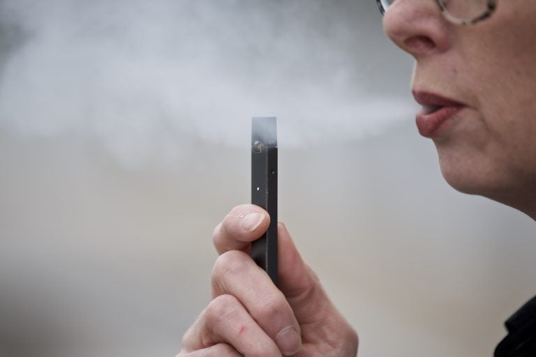 Chantel Williams exhales a puff of vapor from a Juul pen in Vancouver, Wash., Tuesday, April 16, 2019. (Craig Mitchelldyer/AP Photo)