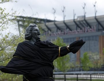 A partially covered statue of singer Kate Smith is seen near the Wells Fargo Center, Friday, April 19, 2019, in Philadelphia. The Philadelphia Flyers covered the statue of singer Kate Smith outside their arena, following the New York Yankees in cutting ties and looking into allegations of racism against the 1930s star with a popular recording of 