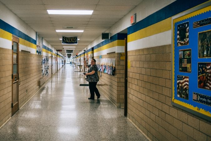 A staff member in Turkeyfoot waves hello as she gets ready for students to leave at the end of the school day. (Dani Fresh/Keystone Crossroads)