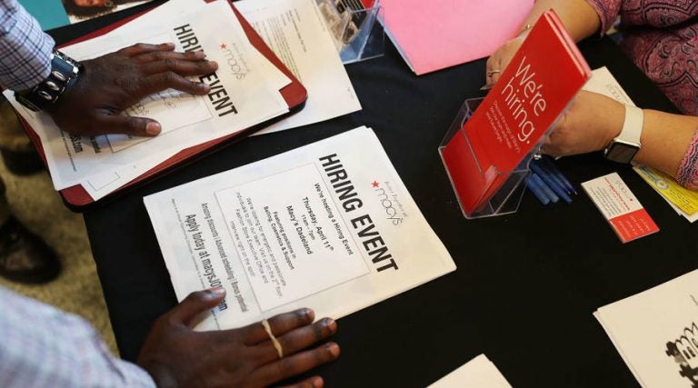 After adjusting for inflation, black workers' median weekly earnings have risen at a fraction of the pace of wages for white, Hispanic and Asian workers. (Joe Raedle/Getty Images)