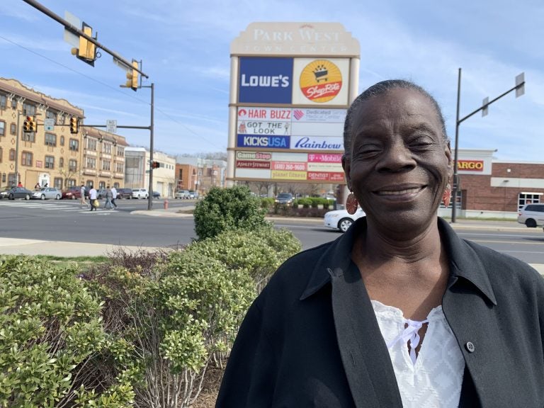  Lucinda Hudson at the site where Starbucks plans to put a new location, a first for the neighborhood. (Aaron Moselle/WHYY)