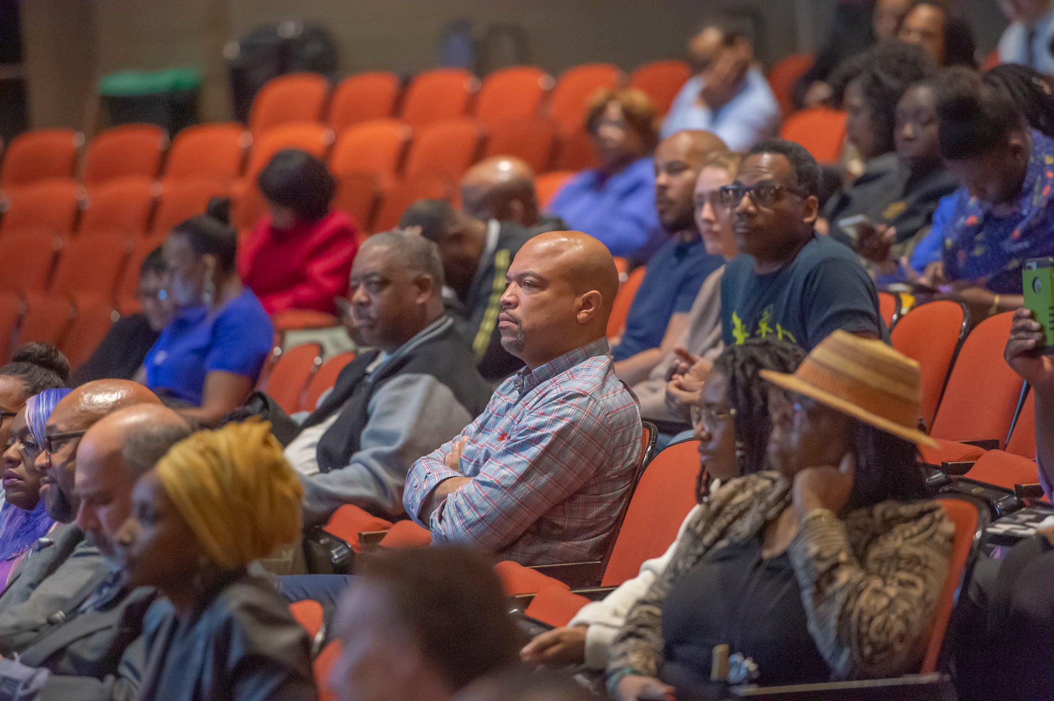 Audience members react to candidates' performance at PACE mayoral forum