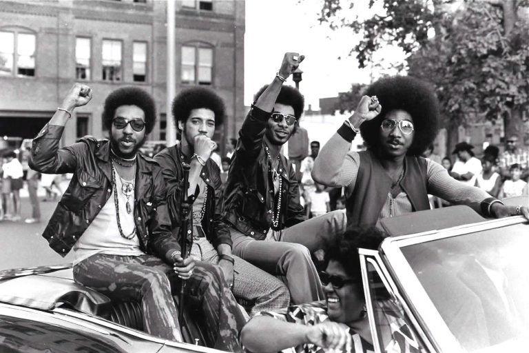 Members of the Nat Turner Rebellion ride in a parade during a Harambe Festival in Springfield, Mass., in the early 1970s. Pictured from left are Major Harris, Ron Hopper, Bill Stratley, and Joe Jefferson. (Courtesy of Reservoir Media)