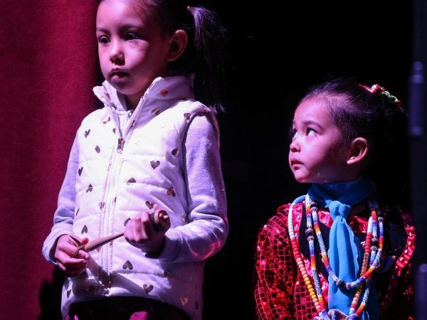 Heart Rose (left) and Star Bear Richardson prepare to dance and sing at We Are the Seeds, an indigenous cultural festival making its debut in Philadelphia.(Angela Gervasi for WHYY)