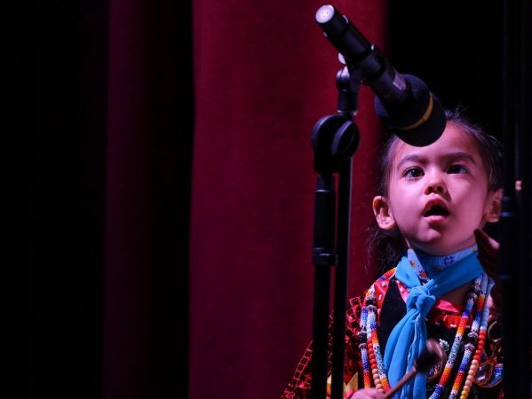 Star Bear Richardson, 4, sings during a performance at We Are the Seeds. (Angela Gervasi for WHYY)