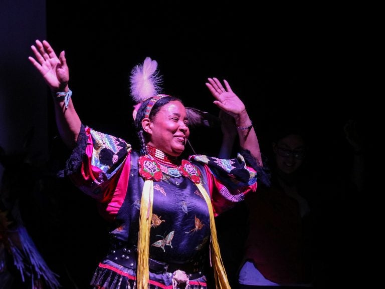 Vaughnda Hilton, founder of the indigenous dance troupe Native Nations Dance Theater, celebrates with audience members during a friendship dance (Angela Gervasi for WHYY)