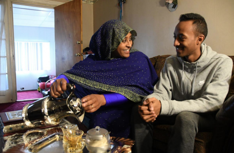 Sawsan Ali, left, and son Maaz Mohammed celebrate the fall of Sudanese leader Omar Al-Bashir. (Abdul R. Sulayman/The Philadelphia Tribune)