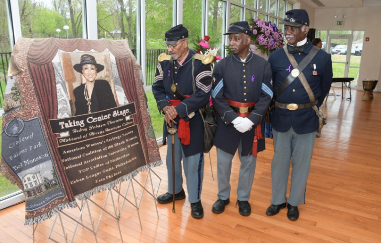 Buffalo Soldiers admire a picture of Audrey Patrick Johnson-Thorton (Abdul R. Sulayman/The Philadelphia Tribune)