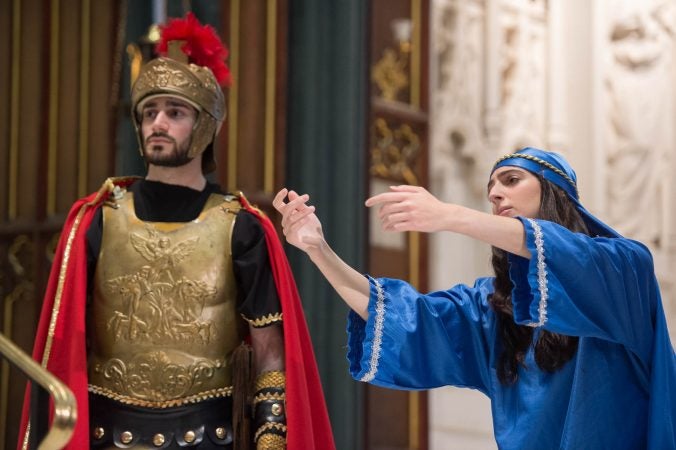 Mary, portrayed by Melanie Ashe, reaches out to Jesus as he carries the cross. (Jonathan Wilson for WHYY)