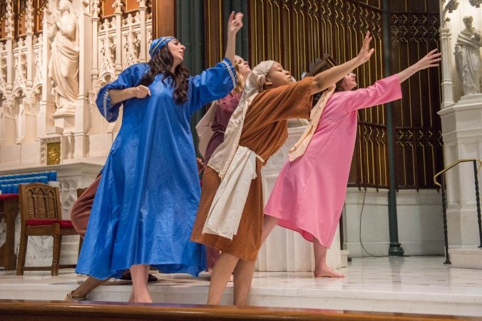 Mary, Veronica, and the Weeping Women reach out to Jesus as he carries the cross. (Jonathan Wilson for WHYY)