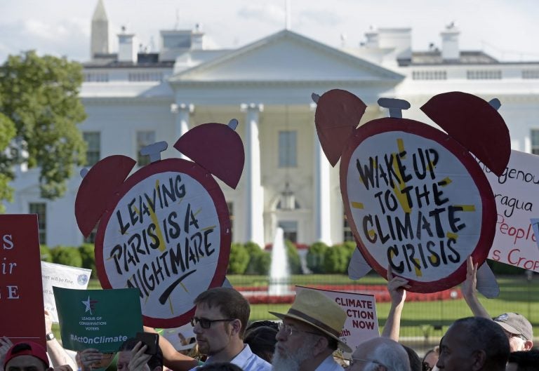 Protesters gather outside the White House in Washington, Thursday, June 1, 2017, to protest President Donald Trump's decision to withdraw the Unites States from the Paris climate change accord. (Susan Walsh/AP Photo)