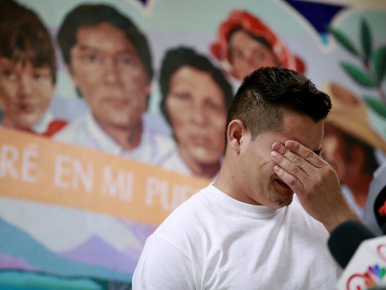 In this June 2018 photo, Christian, from Honduras, recounts his separation from his child at the border. A judge has given the federal government six months to identify children separated from their families. (Matt York/AP)