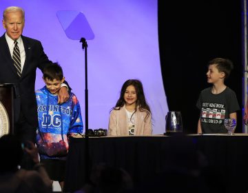 Former Vice President Joe Biden is joined by some children onstage, as he speaks at an International Brotherhood of Electrical Workers conference Friday in Washington. (Manuel Balce Ceneta/AP)