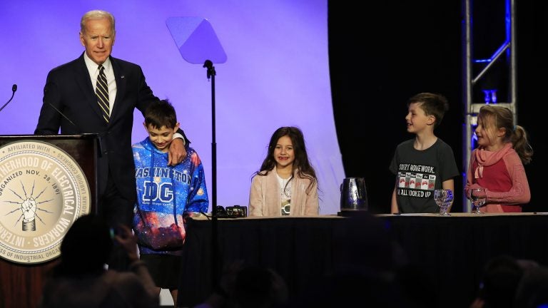 Former Vice President Joe Biden is joined by some children onstage, as he speaks at an International Brotherhood of Electrical Workers conference Friday in Washington. (Manuel Balce Ceneta/AP)
