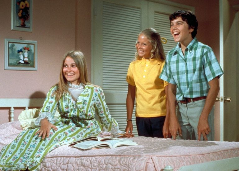 The Brady Bunch, circa 1970, with oldest sister Marcia seated in front. In one episode of the show from 1969, the sisters and brothers all stay home from school with measles. (ABC Photo Archives/Getty Images)