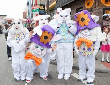 People dressed as Easter bunnies pose for a photo.