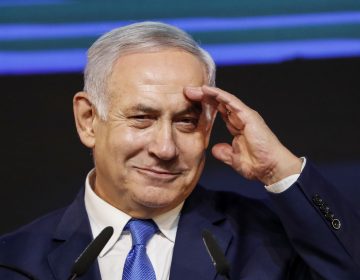 Israeli Prime Minister Benjamin Netanyahu gestures as he addresses supporters at his Likud Party headquarters in Tel Aviv on election night early on Wednesday. (Thomas Coex/AFP/Getty Images)