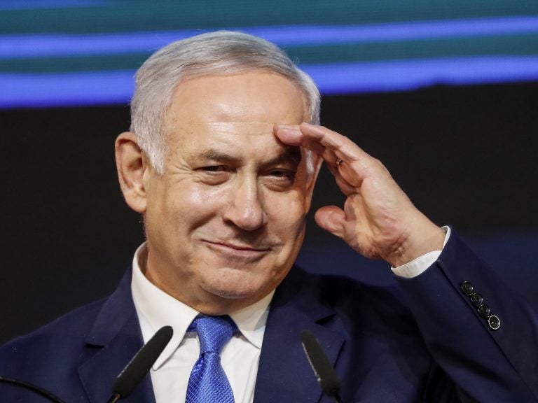 Israeli Prime Minister Benjamin Netanyahu gestures as he addresses supporters at his Likud Party headquarters in Tel Aviv on election night early on Wednesday. (Thomas Coex/AFP/Getty Images)