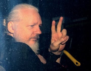 WikiLeaks founder Julian Assange arrives in a police vehicle at Westminster Magistrates court on Thursday in London. He was arrested by Scotland Yard Police Officers inside the Ecuadorian Embassy in Central London. (Jack Taylor/Getty Images)