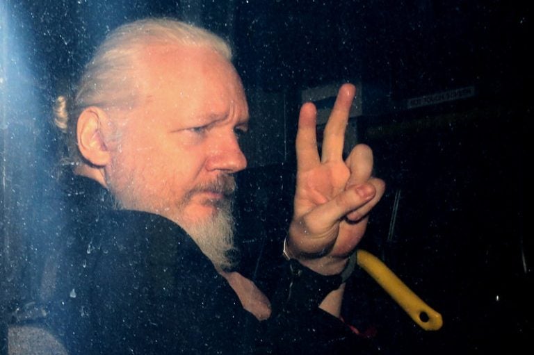 WikiLeaks founder Julian Assange arrives in a police vehicle at Westminster Magistrates court on Thursday in London. He was arrested by Scotland Yard Police Officers inside the Ecuadorian Embassy in Central London. (Jack Taylor/Getty Images)