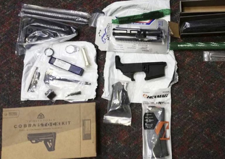 This undated photo provided by the Office of Attorney General of New Jersey shows parts of guns confiscated after being sold by mail order from a California company. New Jersey's attorney general announced a lawsuit Friday, March 22, 2019, against the California company that sells mail-order firearms parts that can be turned into working weapons, the first such action the state has taken since it banned so-called 