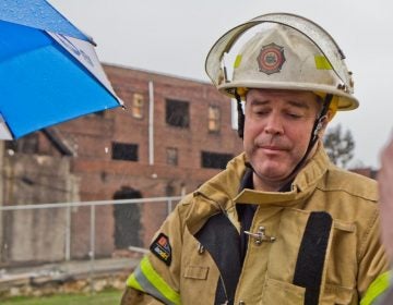 Philadelphia fire commissioner Adam Thiel at The Original Apostolic Faith Church of the Lord Jesus Christ in North Philadelphia in March of 2018, right after a fire broke out at the church. (Kimberly Paynter/WHYY)