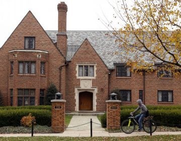 A bicyclist rides past Pennsylvania State University's shuttered Beta Theta Pi fraternity house Thursday, Nov. 9, 2017, in State College, Pa. Centre County, Pa. (Gene J. Puskar/AP Photo)
