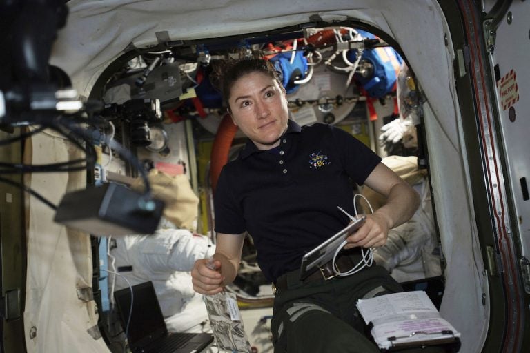 NASA astronaut and Expedition 59 Flight Engineer Christina Koch works on U.S. spacesuits inside the Quest airlock.