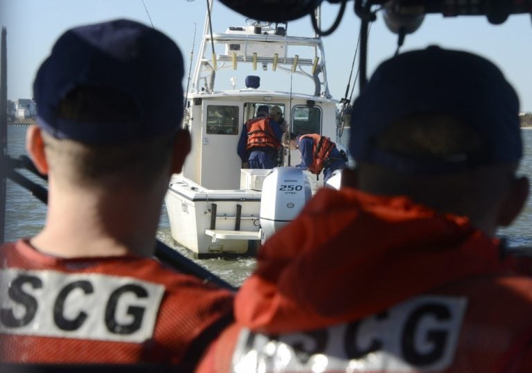 Members of Coast Guard Station Barnegat Light board a recreational fishing vessel while conducting a living marine resources patrol and vessel safety inspection on Nov. 7, 2018. (U.S. Coast Guard photo by Petty Officer 1st Class Seth Johnson)